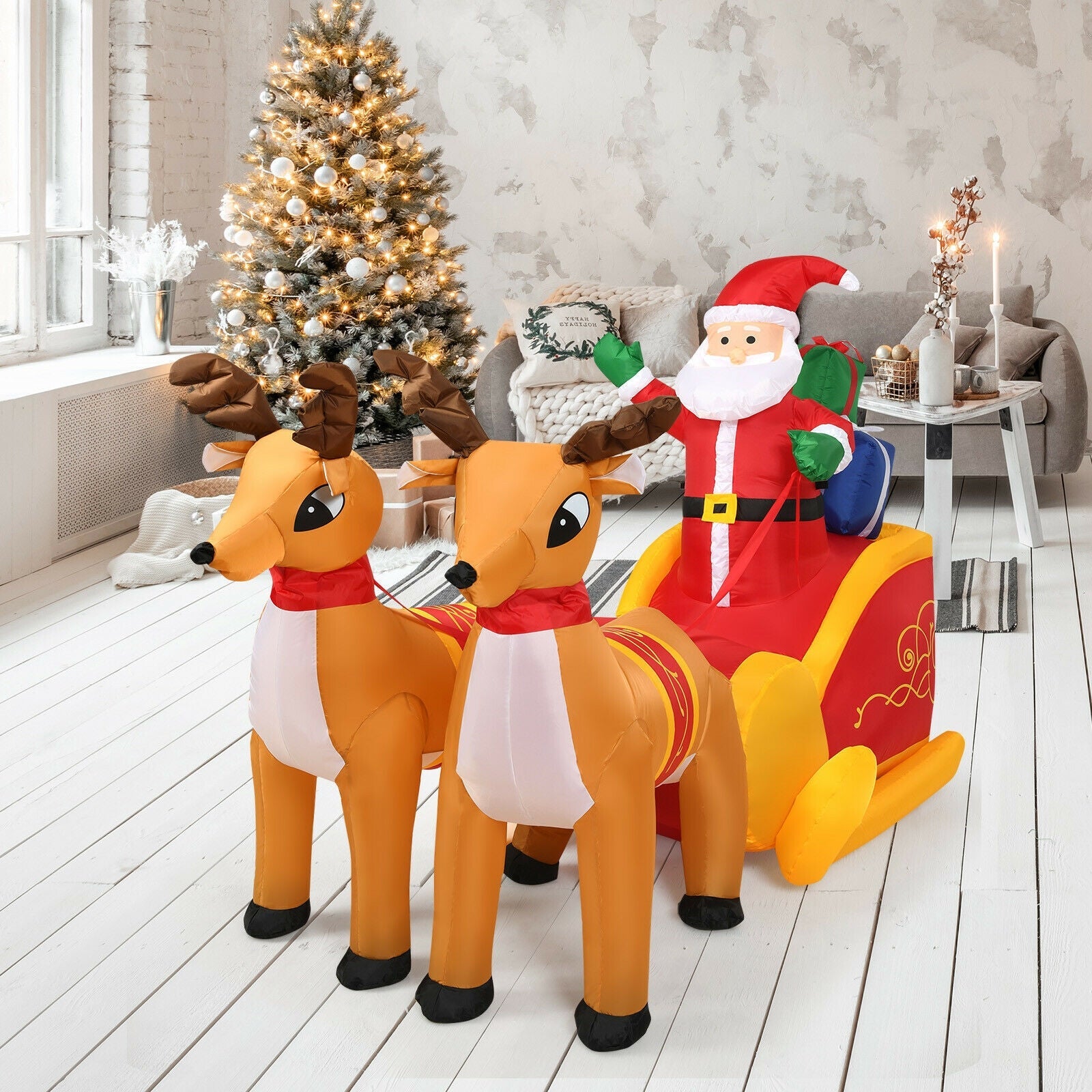 7.5 ft inflatable Santa with 2 brown reindeer pulling a red and yellow sleigh on Tampa Home & Garden Store