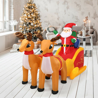 7.5 ft inflatable Santa with 2 brown reindeer pulling a red and yellow sleigh on Tampa Home & Garden Store