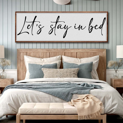 Let's Stay in Bed Bedroom Sign II canvas wall art with black script in wooden frame on Tampa Home & Garden Store