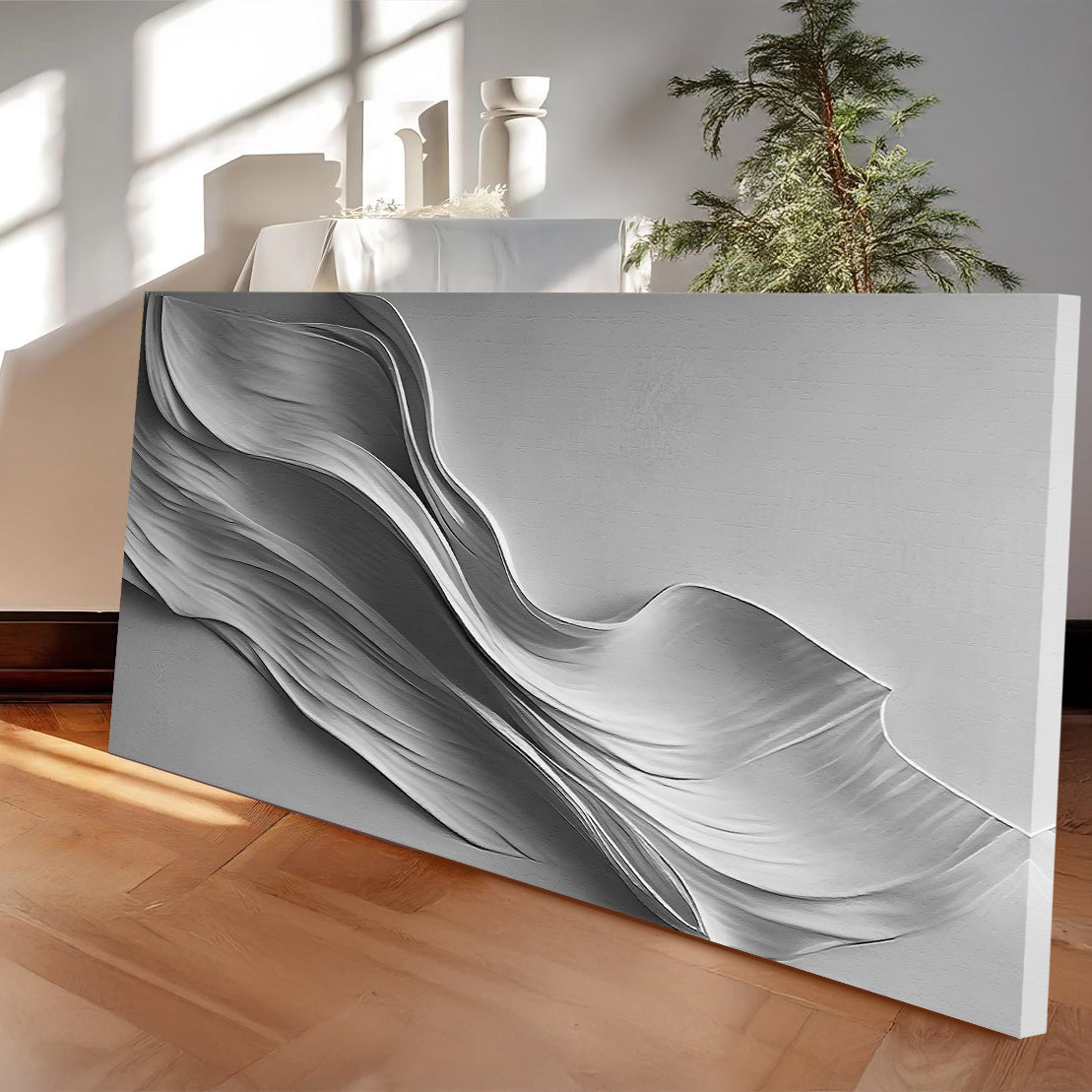 Stormy Gray Minimalist Wall Art canvas with flowing grayscale waves, resting on the floor on Tampa Home & Garden Store
