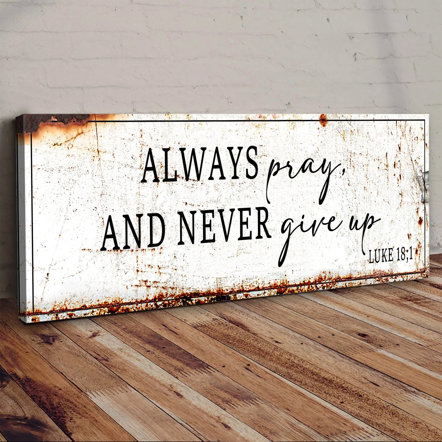 Always Pray And Never Give Up canvas sign with rusted edge and black text on white canvas on Tampa Home & Garden Store