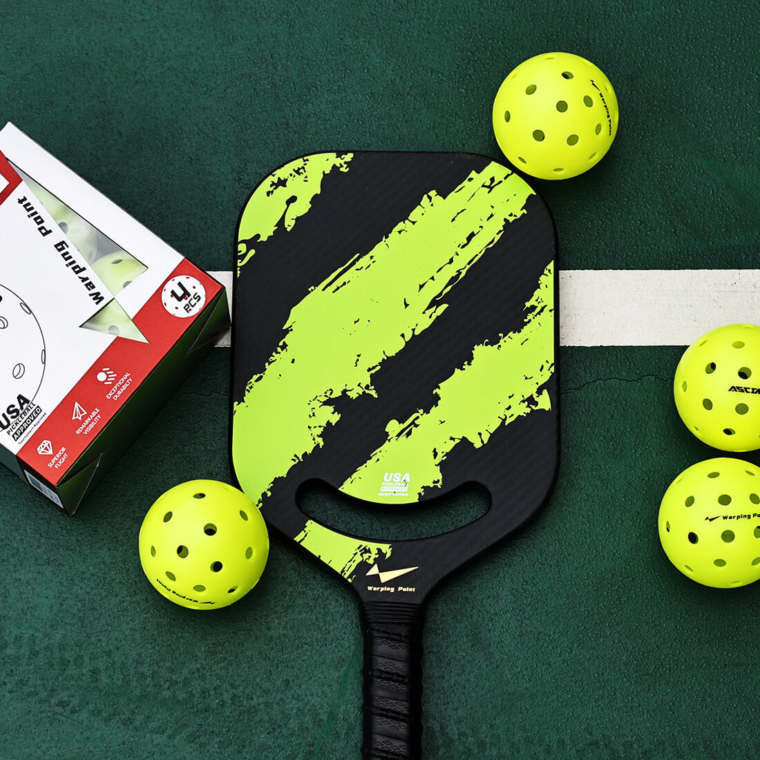 Ascent Pickleballs by Warping Point; neon yellow balls surround a black lime paddle on a court on Tampa Home & Garden Store