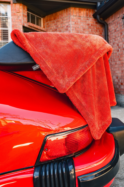 BLACKLINE Twisted-Loop Drying Towel red towel draped over car trunk for drying on Tampa Home & Garden Store