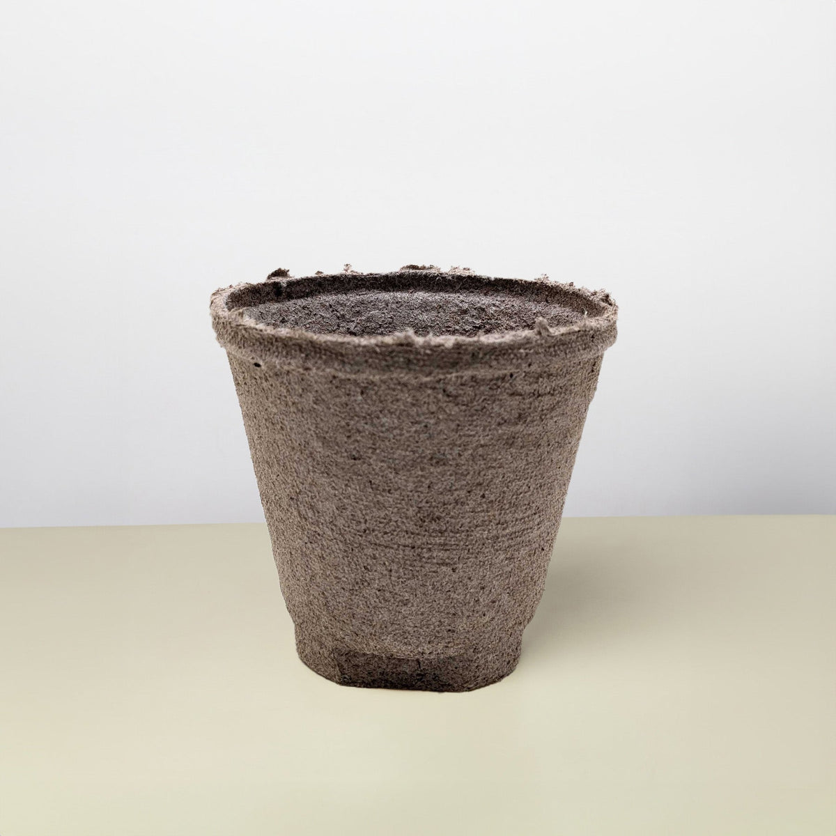 Cow Pot textured brown plant pot with a rough, frayed rim on Tampa Home & Garden Store