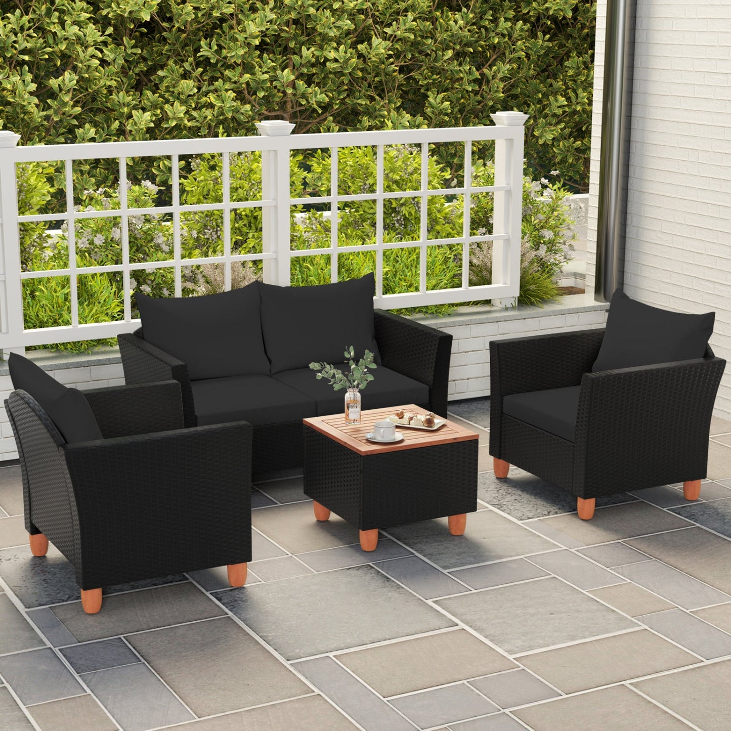 DirectDeals 4-Piece Patio Conversation Set with Storage Coffee Table in black wicker cushions on Tampa Home & Garden Store