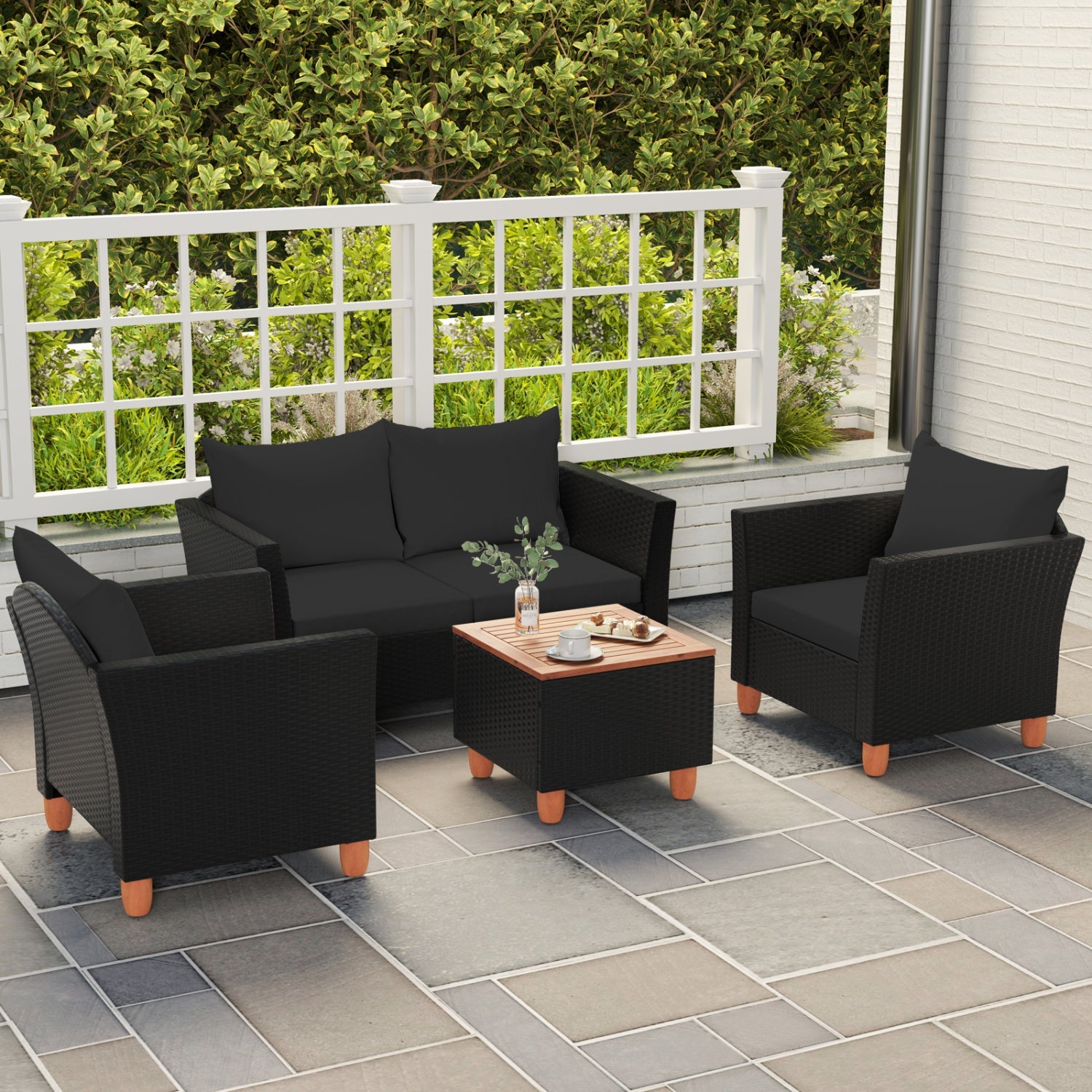 DirectDeals 4-Piece Patio Conversation Set with Storage Coffee Table in black wicker cushions on Tampa Home & Garden Store