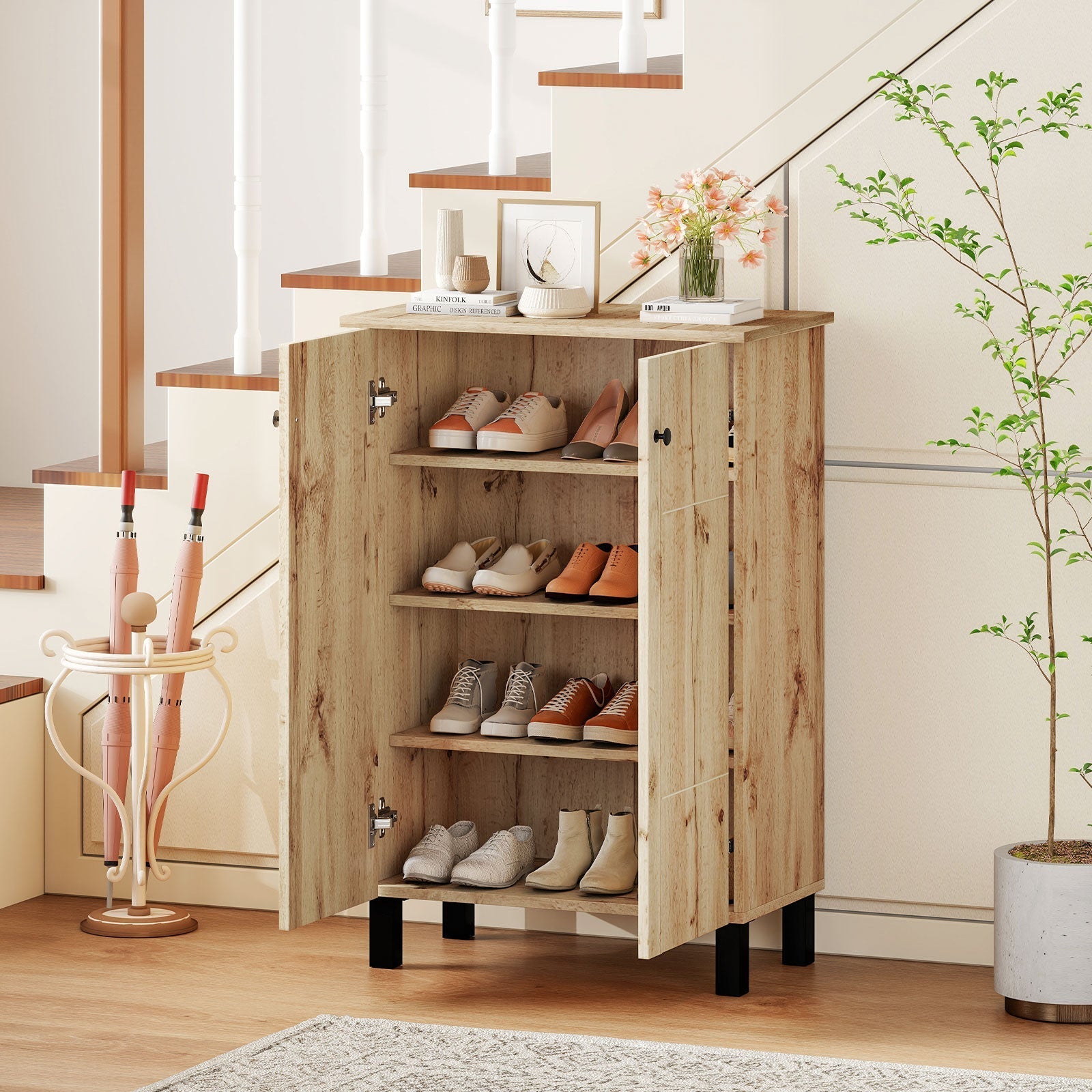 Shoe cabinet in natural wood with open doors; pink umbrella stand by staircase in an entryway on Tampa Home & Garden Store