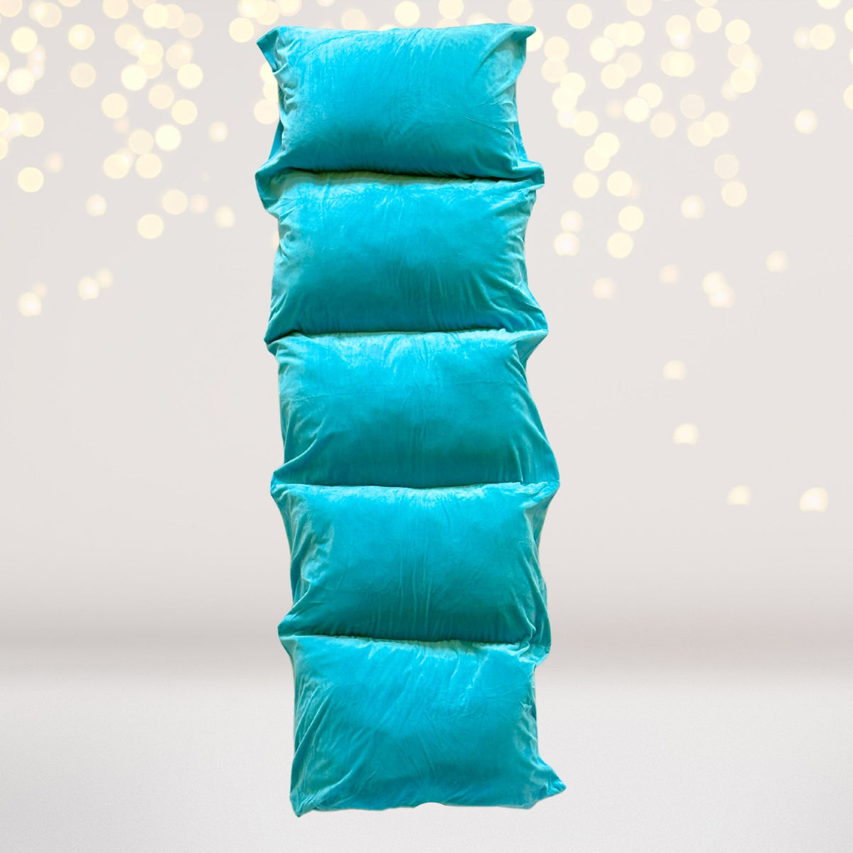 Turquoise blue pillow floor lounger with a soft shiny cover on Tampa Home & Garden Store