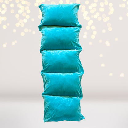 Turquoise blue pillow floor lounger with a soft shiny cover on Tampa Home & Garden Store