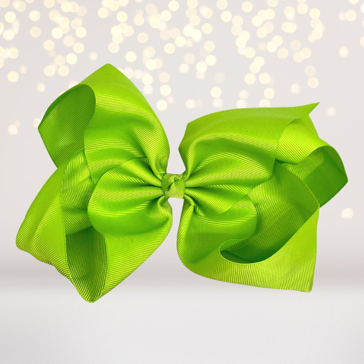 Pair of 8-inch lime green grosgrain hair bows on alligator clips by Chicky Chicky Bling Bling on Tampa Home & Garden Store