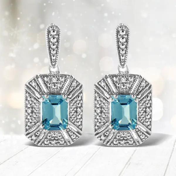 Pair of sterling silver drop earrings with emerald-cut blue topaz halo and diamond accents on Tampa Home & Garden Store