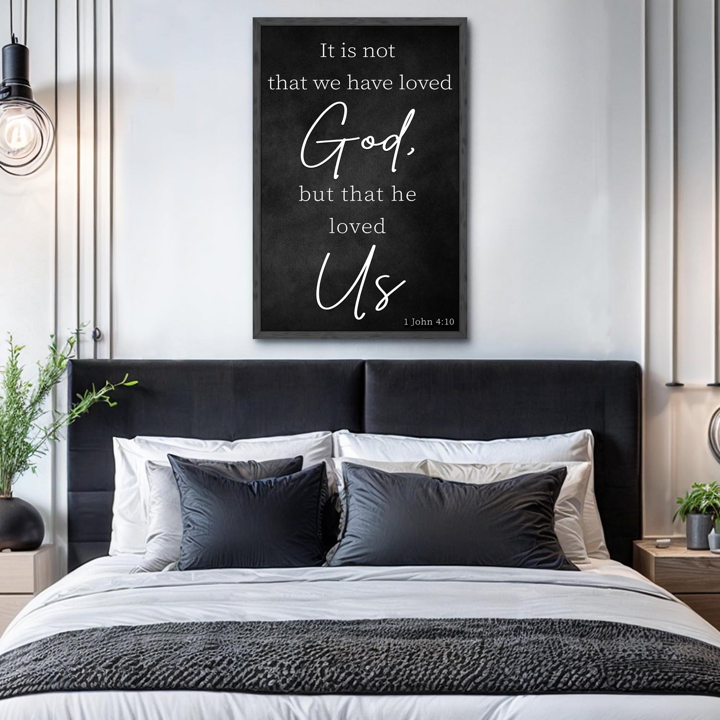 Canvas sign Tailored Canvases, black framed chalkboard-style surface with white scripture 1 John 4:10 on Tampa Home & Garden Store