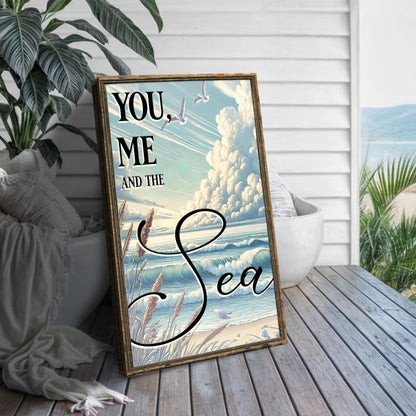 You Me and the Sea Coastal Sign III canvas framed artwork leaning beside a plant on Tampa Home & Garden Store