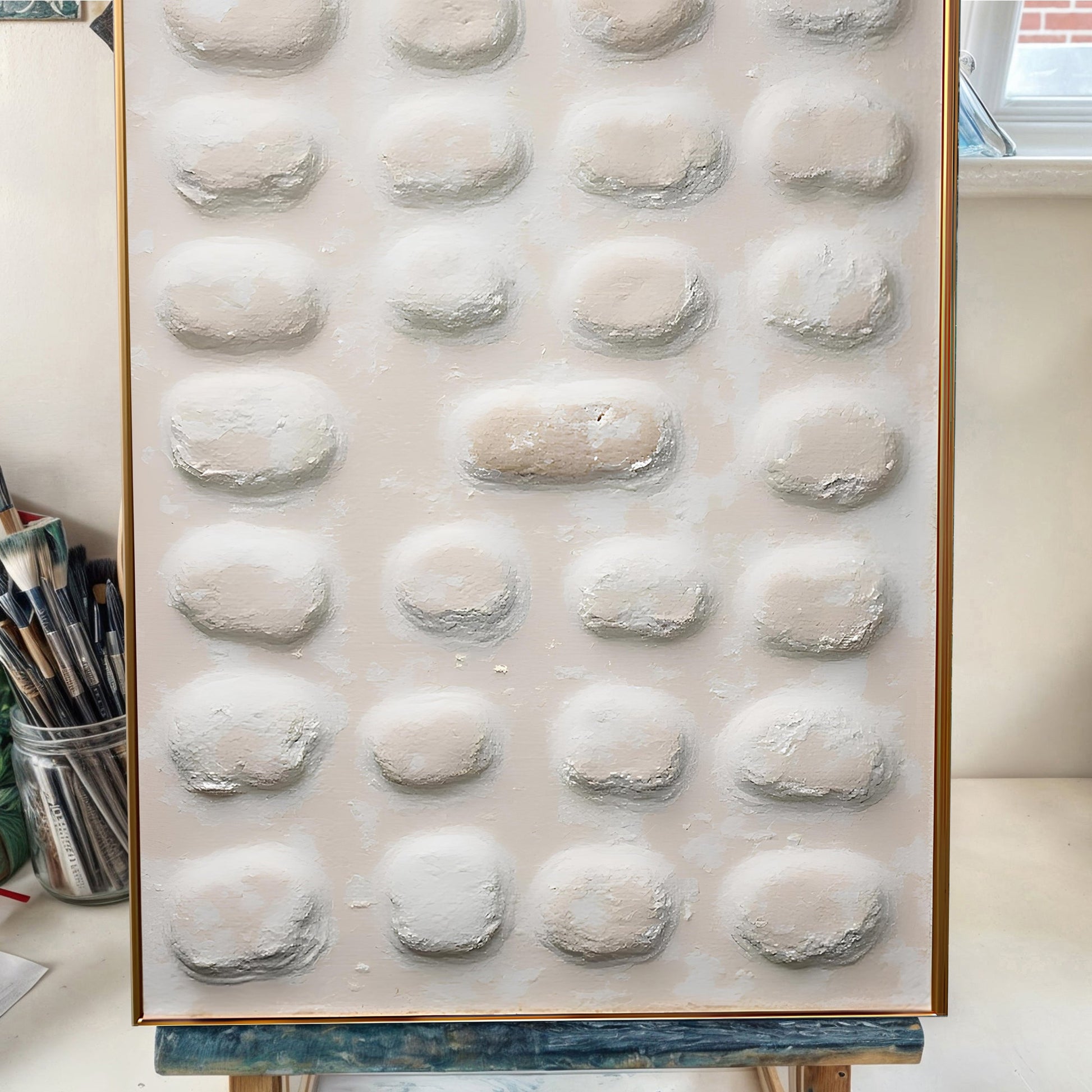 Abstract Minimalist Wall Art II canvas with raised beige circular textures and a gold frame on Tampa Home & Garden Store