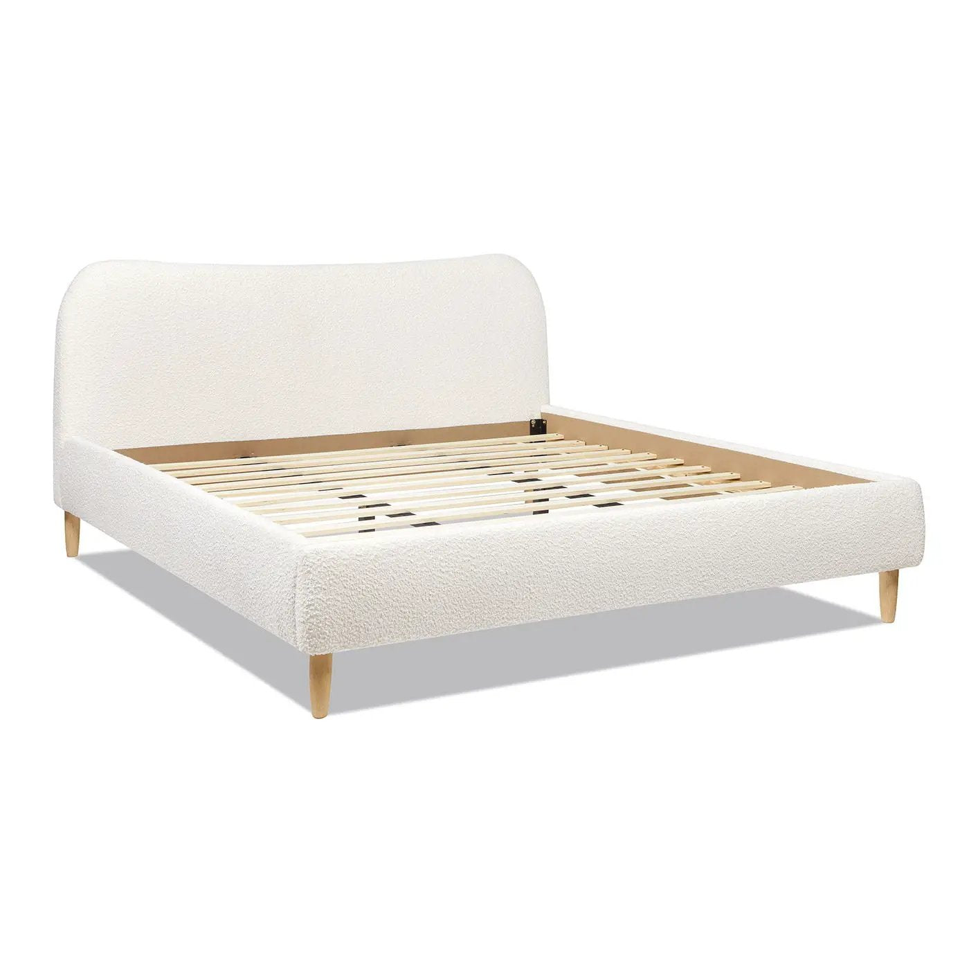 Roman curved headboard upholstered platform bed ivory boucle fabric with light wood legs on Tampa Home & Garden Store