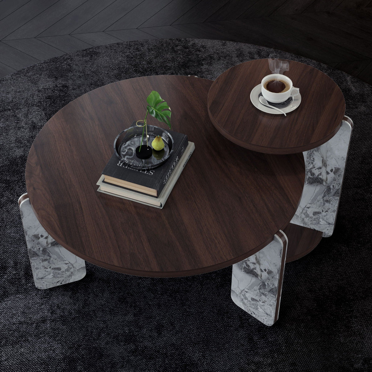 Two round dark brown coffee tables with faux marble tops; coffee cup and plant on rug on Tampa Home & Garden Store