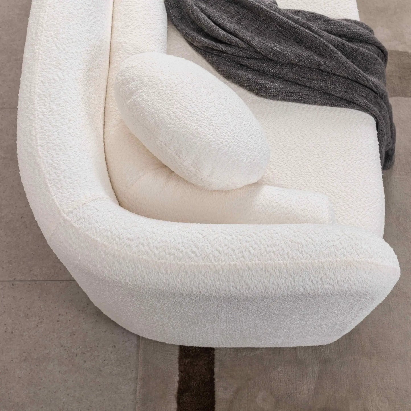 Luxury Modern Couch 3-Seater stationary sofa in cream boucle with dark gray throw on Tampa Home & Garden Store
