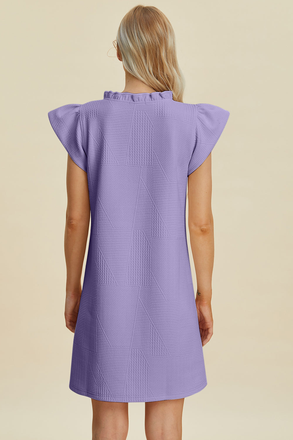 Stevvex ruffled V-neck cap sleeve dress back view in lavender with geometric quilting on Tampa Home & Garden Store
