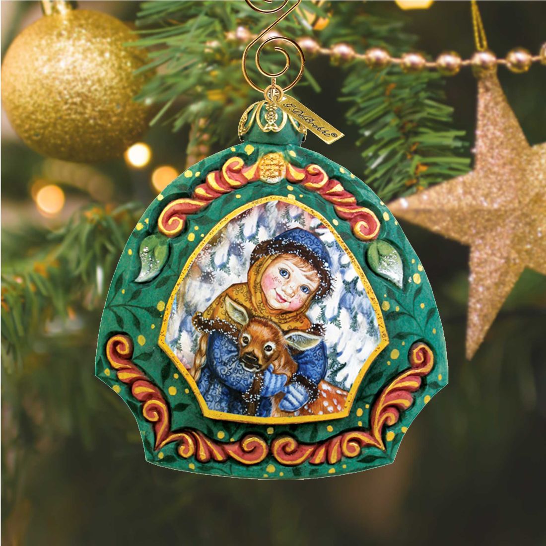 Girl with Deer Hand-Painted Christmas Ornament by G. DeBrekht in green frame with gold trim on Tampa Home & Garden Store