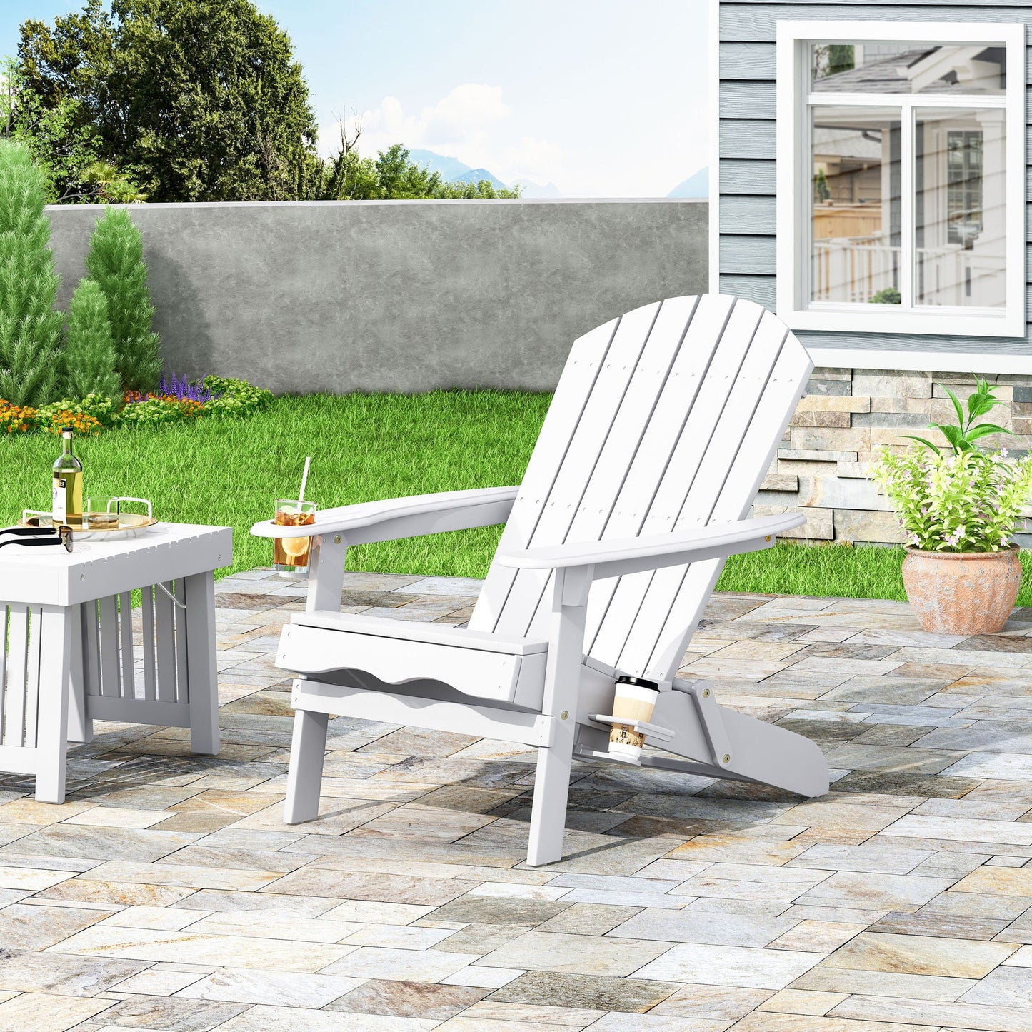 Zenithia foldable Adirondack chair with 2 cup holders white on a patio with other chairs on Tampa Home & Garden Store