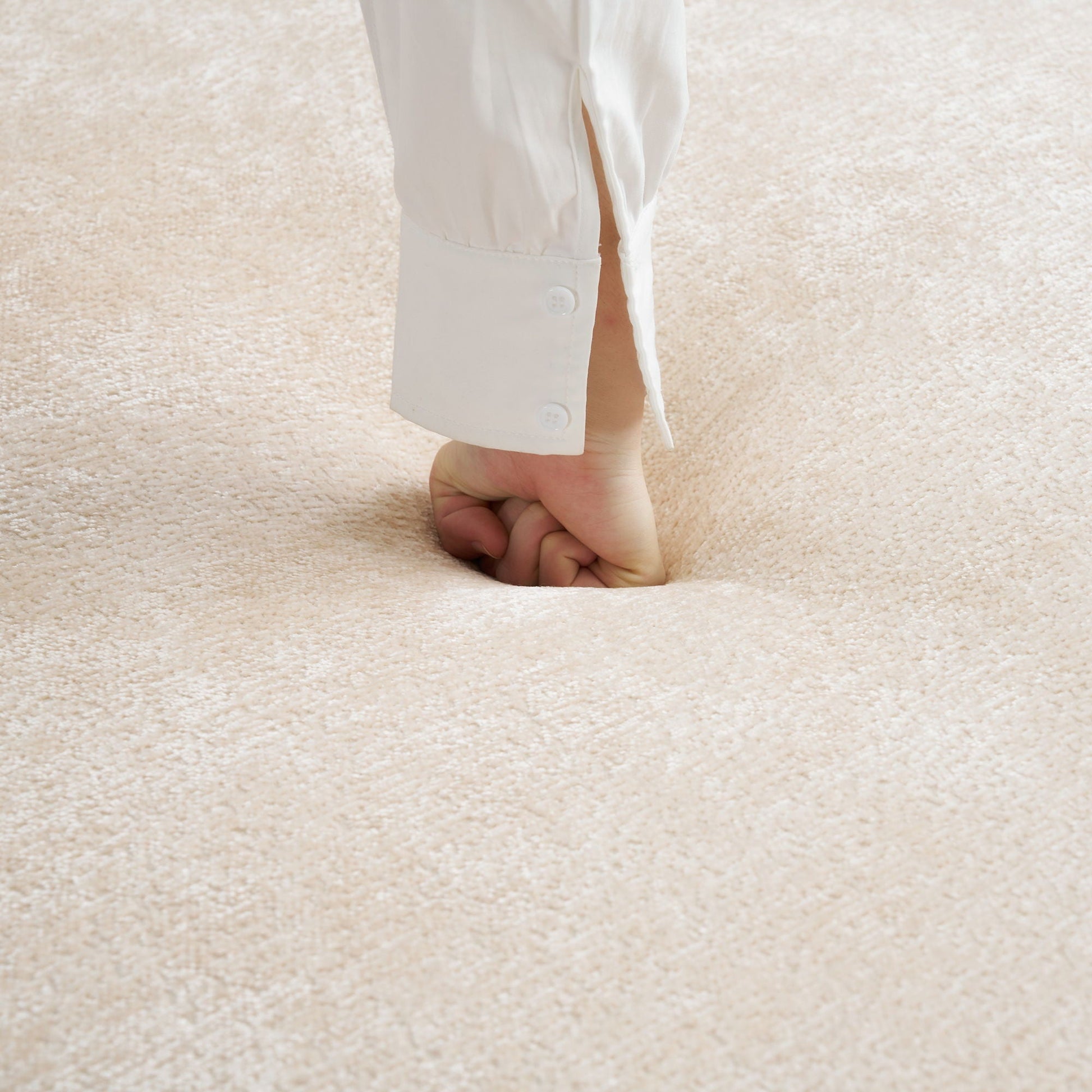 White shirt cuff with buttons on beige carpet HouseOfZazla on Tampa Home & Garden Store