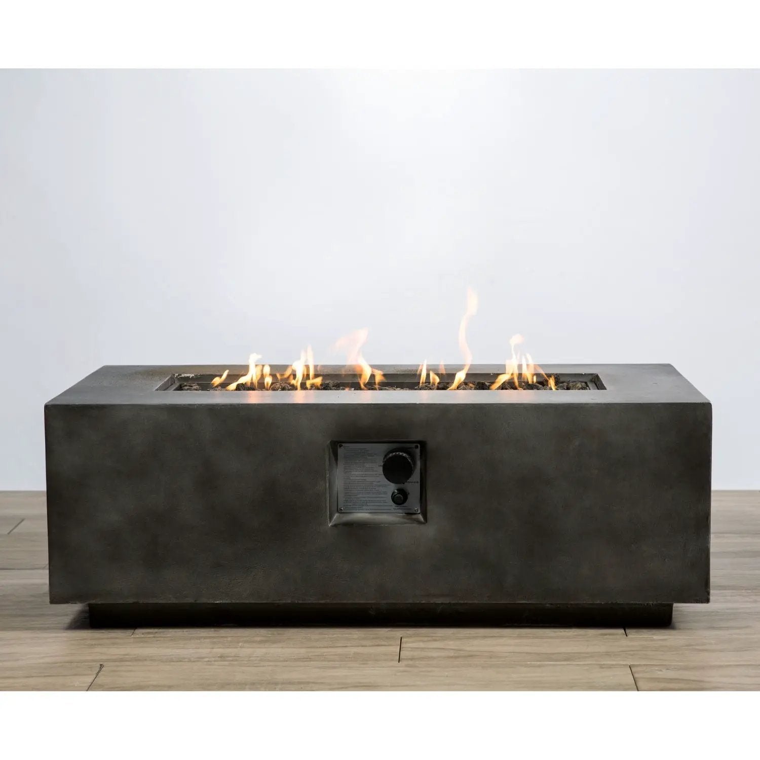 Lightweight fire pit table in dark concrete with gas flames and front control panel on Tampa Home & Garden Store