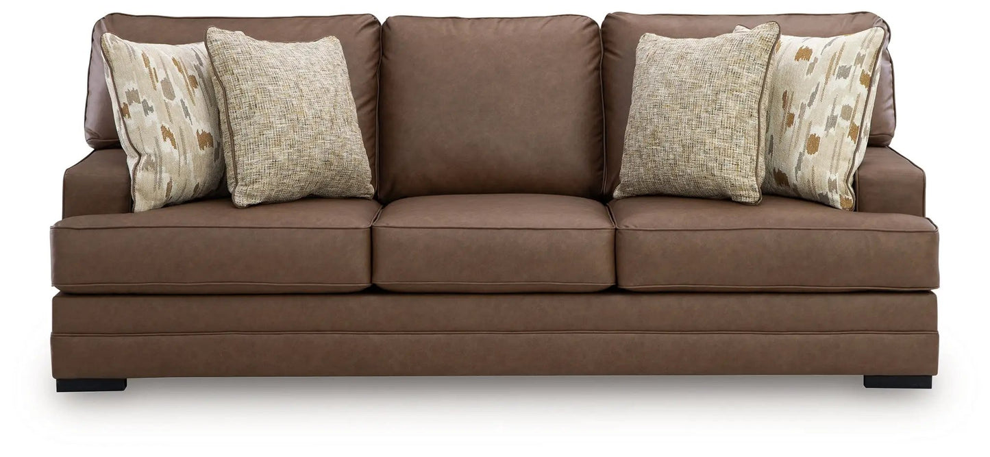 VillaCourt Sofa caramel brown leather upholstery stationary sofa with neutral pillows on Tampa Home & Garden Store