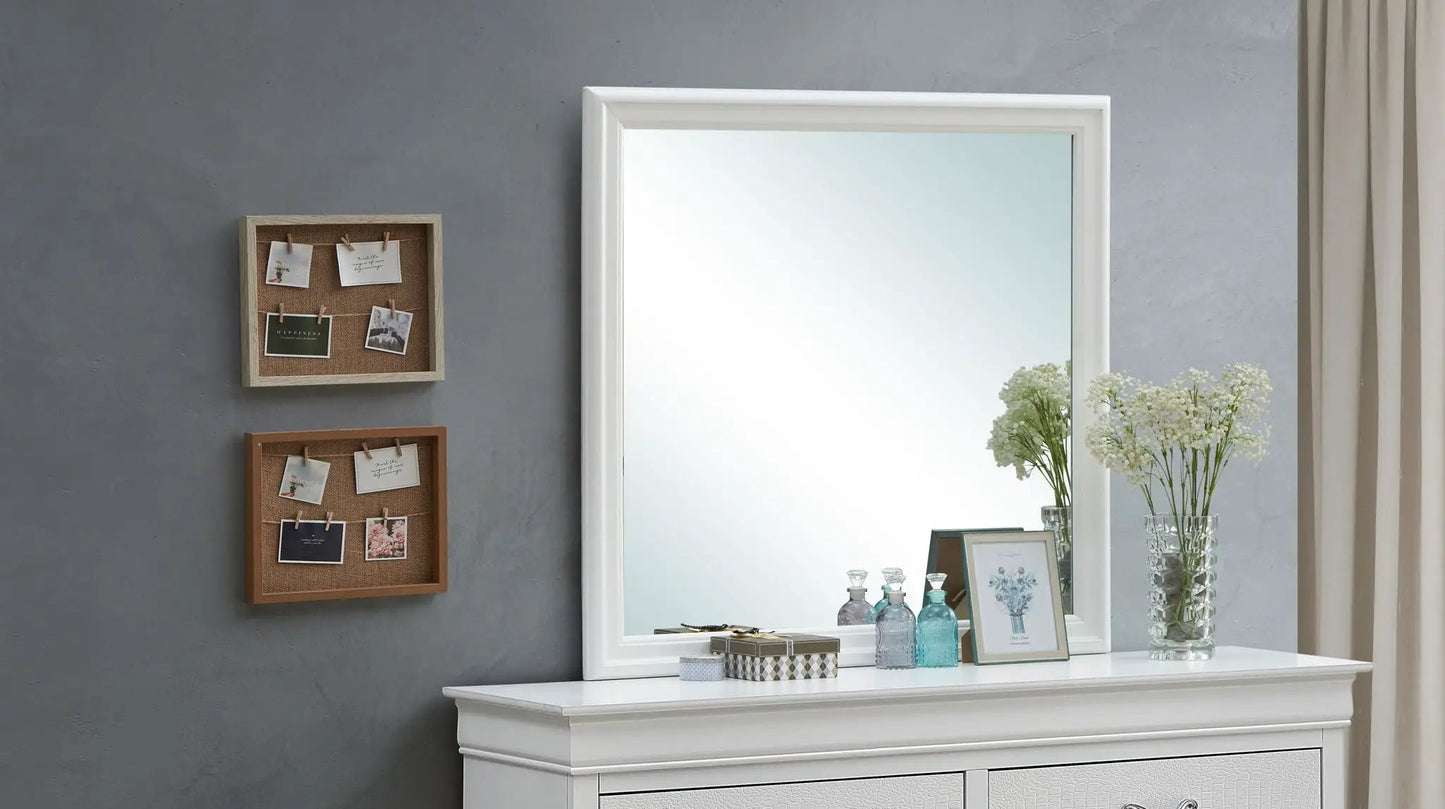 Traditional wall mirror with white frame above a dresser on a gray wall, vases and flowers on Tampa Home & Garden Store