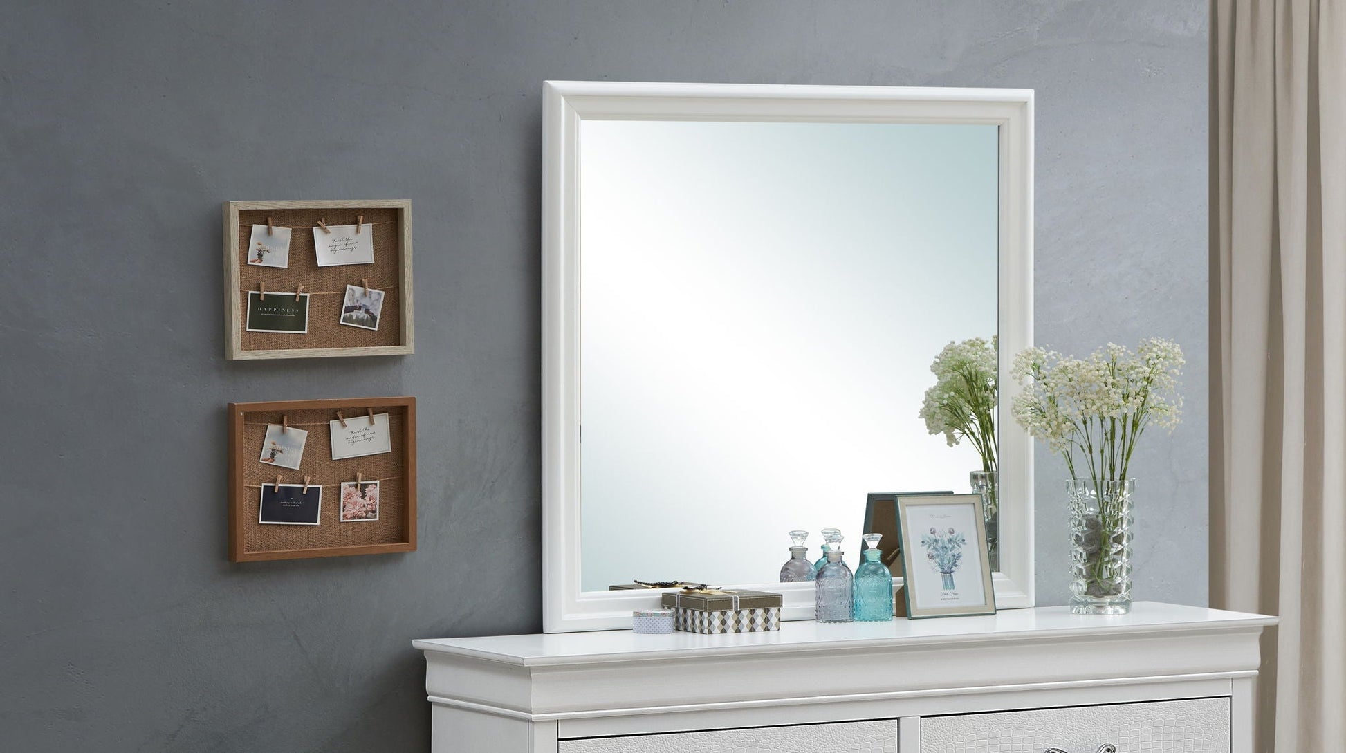 Traditional wall mirror with wood veneer frame, white finish reflects light on dresser on Tampa Home & Garden Store