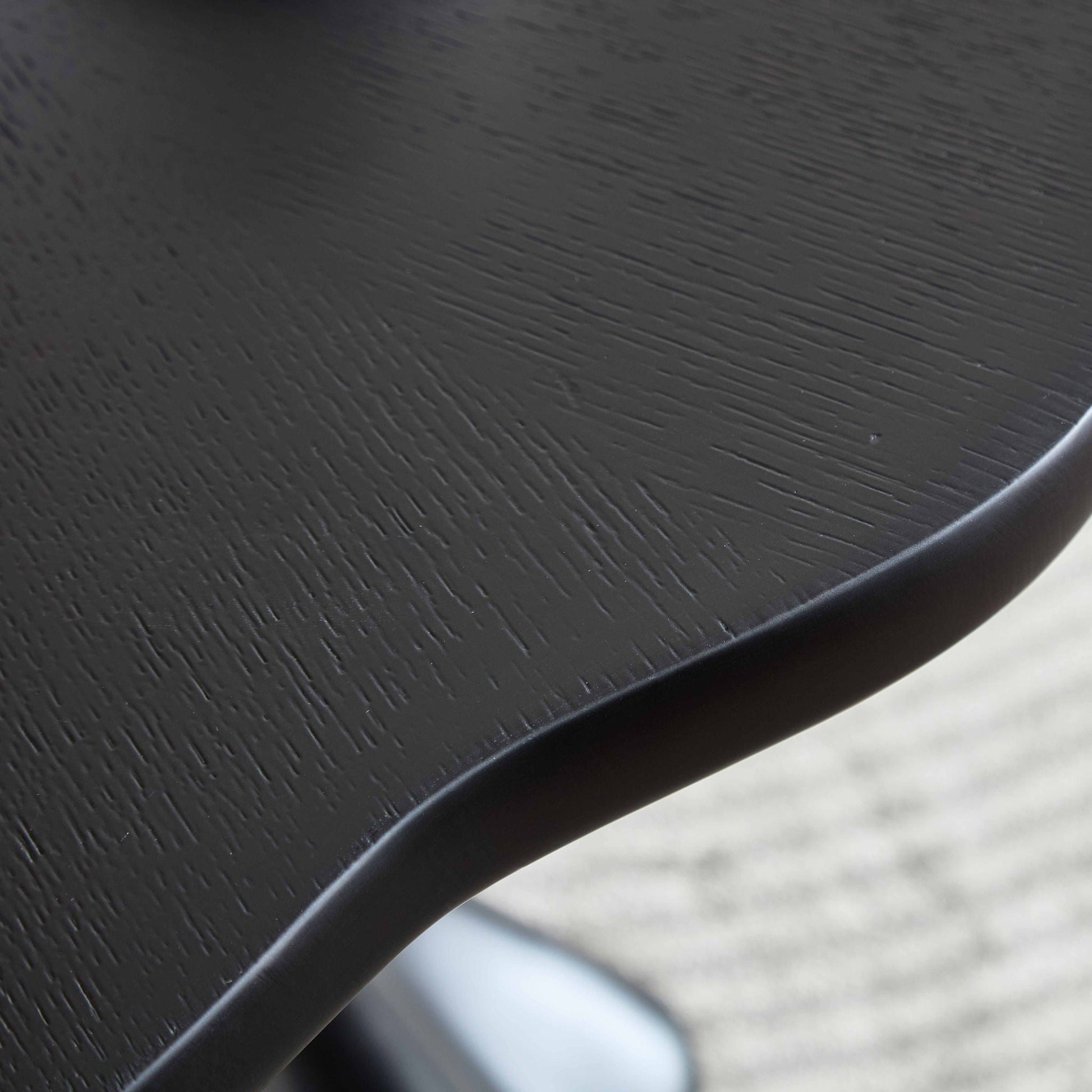 Sculptural round dining table in black with petal shape root texture by HouseOfZazla on Tampa Home & Garden Store