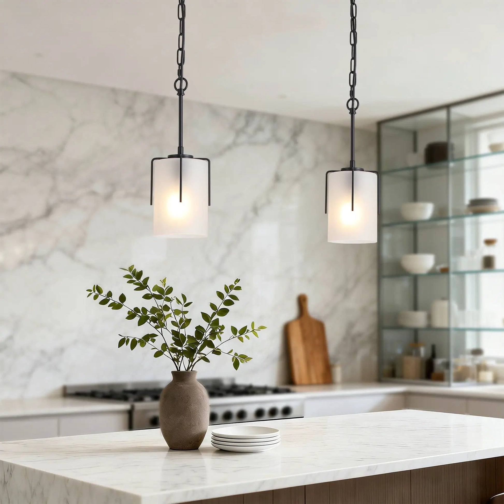 Two adjustable cylindrical pendant lights with white frosted glass shades and black metal frames on Tampa Home & Garden Store