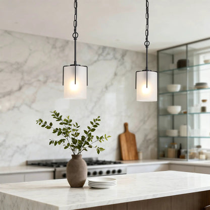 Two adjustable cylindrical pendant lights with white frosted glass shades and black metal frames on Tampa Home & Garden Store