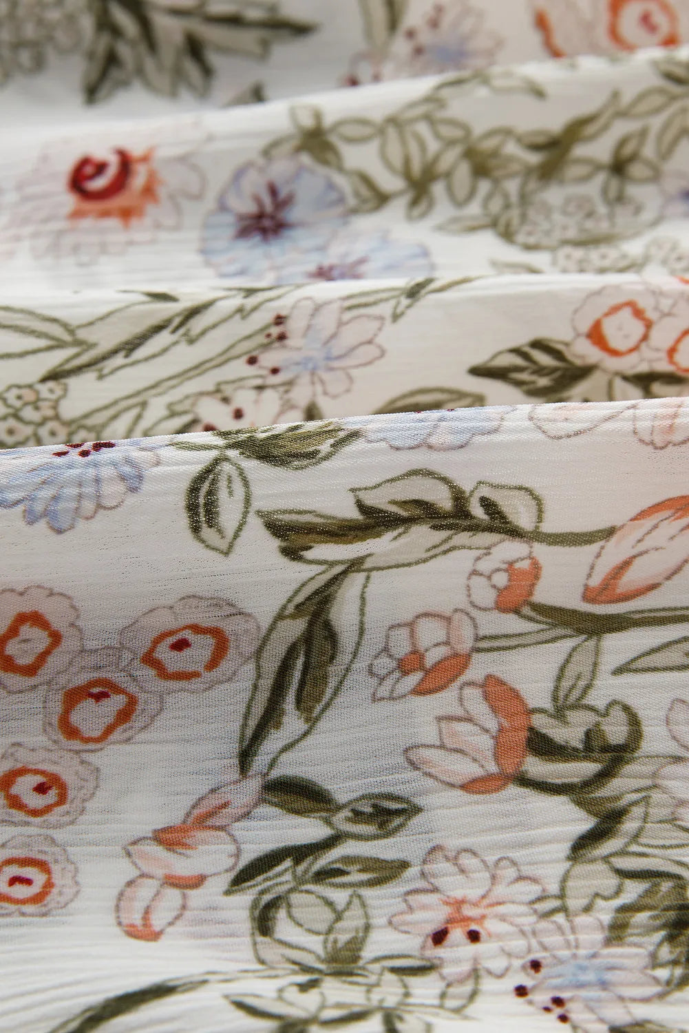 Floral printed mini dress fabric by Stevvex with white base and pink, blue flowers on Tampa Home & Garden Store