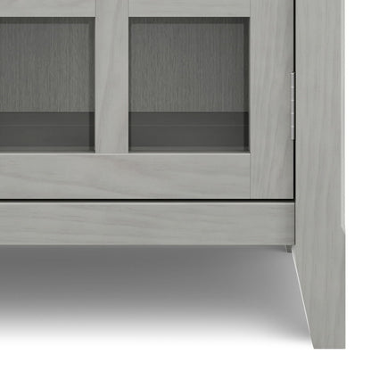 Acadian handcrafted entryway storage cabinet in light gray wood with glass panel doors on Tampa Home & Garden Store