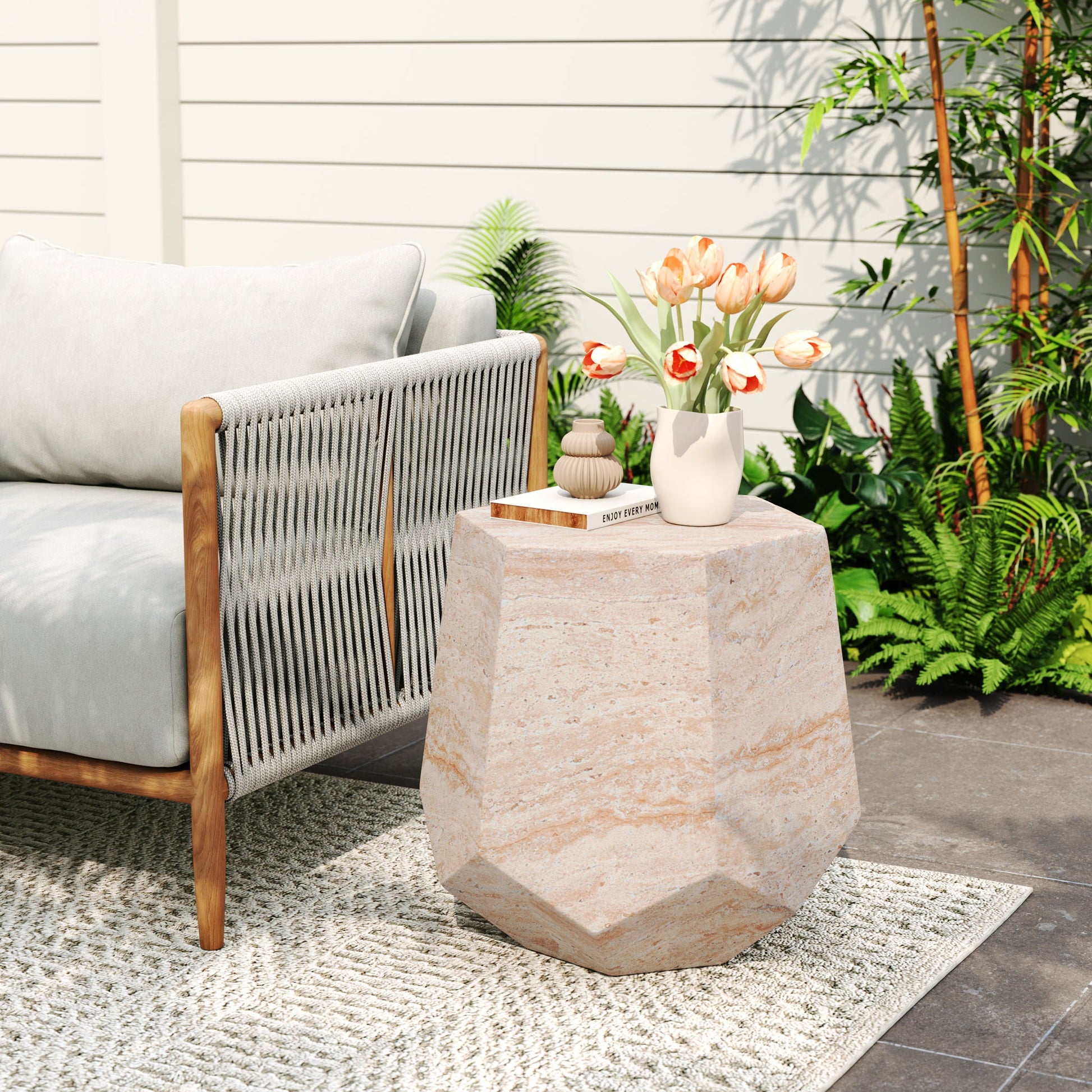 Lightweight concrete side table with hexagonal base beside a gray outdoor sofa, tulip vase atop on Tampa Home & Garden Store