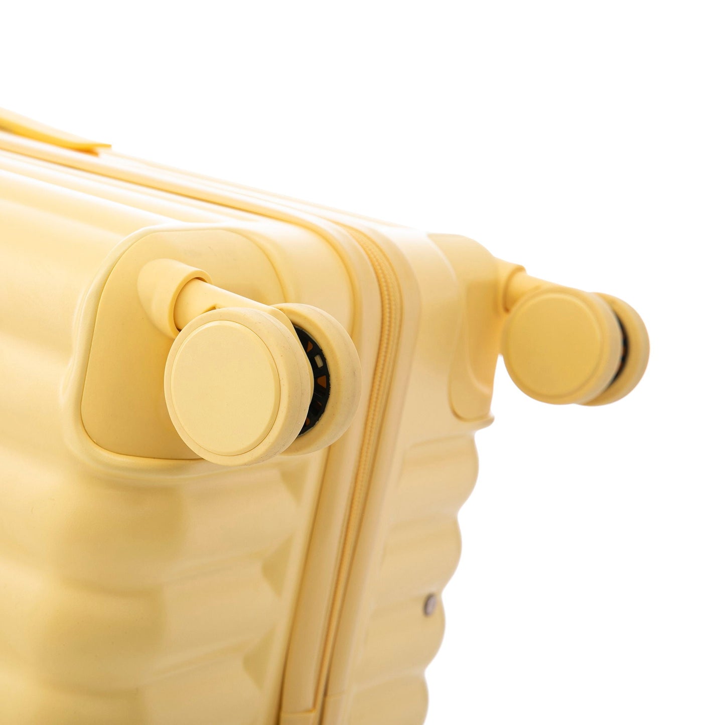 Yellow carry-on spinner luggage with visible wheel assembly and zipper detail on the side on Tampa Home & Garden Store