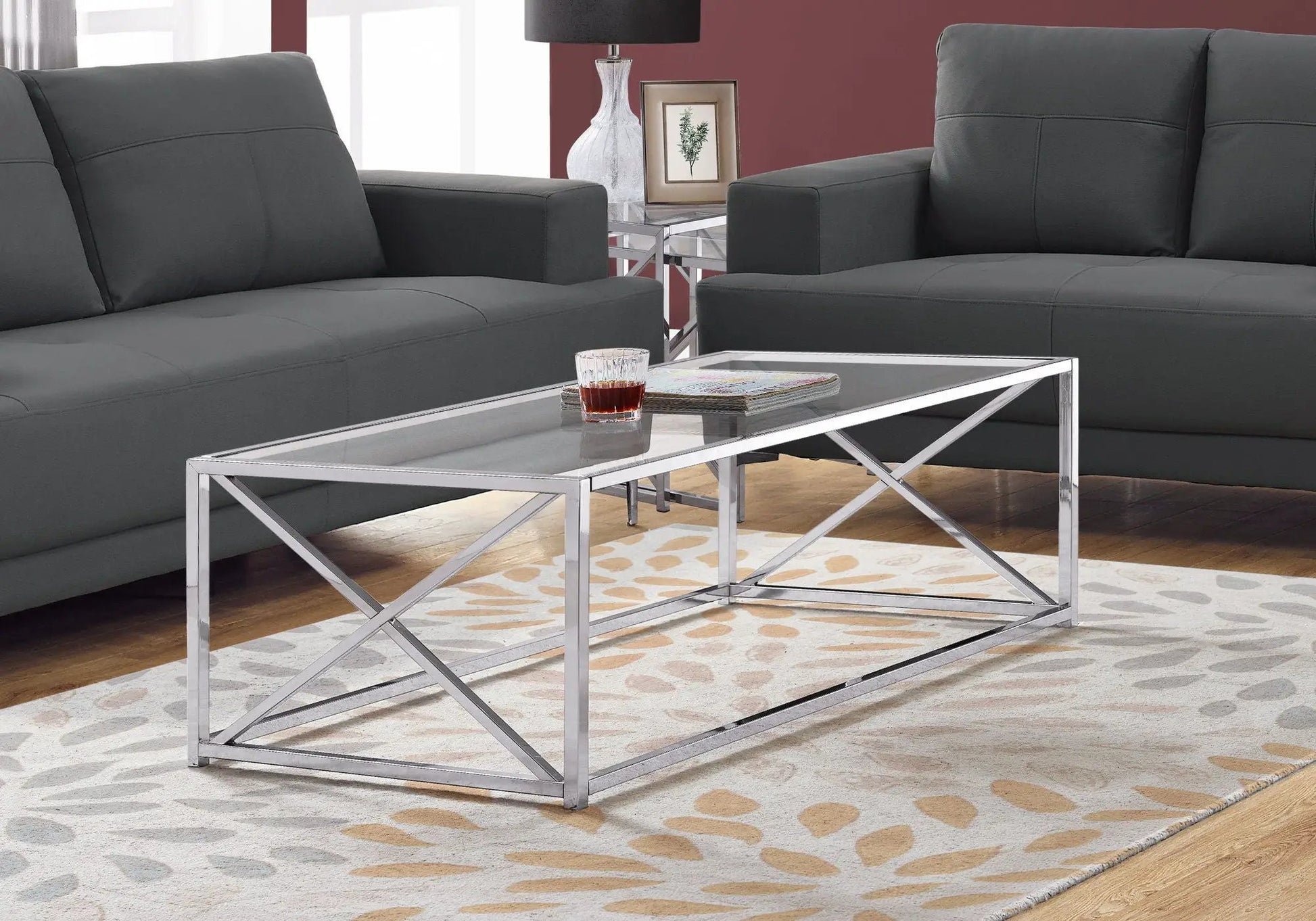 Rectangular chrome coffee table with glass top in a contemporary living room on Tampa Home & Garden Store