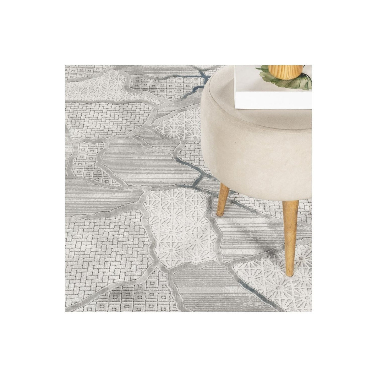 Contemporary geometric area rug gray texture under beige chair by HouseOfZazla on Tampa Home & Garden Store