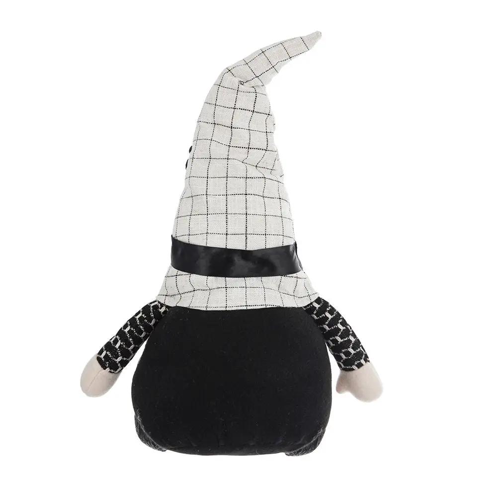 Sitting gnome figurine with black plush body, white grid-pattern hat, and plaid sleeves on Tampa Home & Garden Store