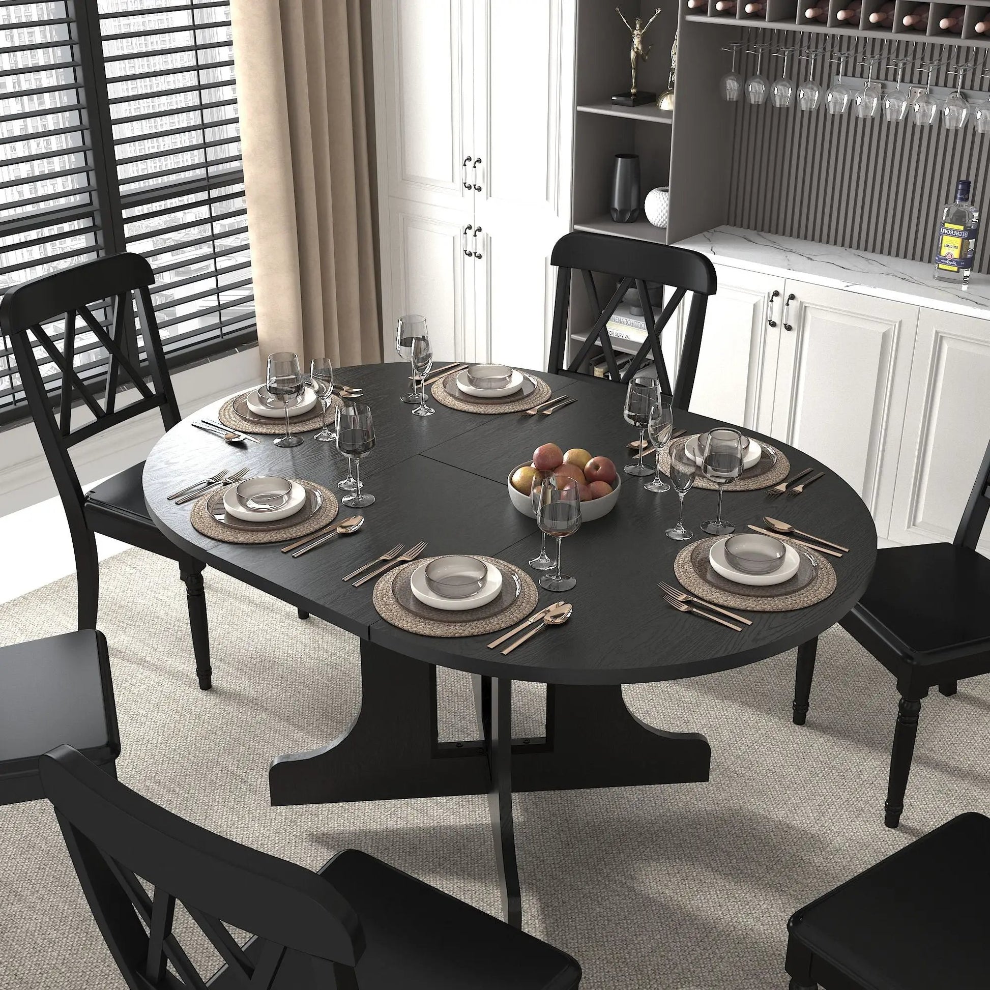 Expandable black oval dining table with removable leaf and X-shaped trestle base on Tampa Home & Garden Store