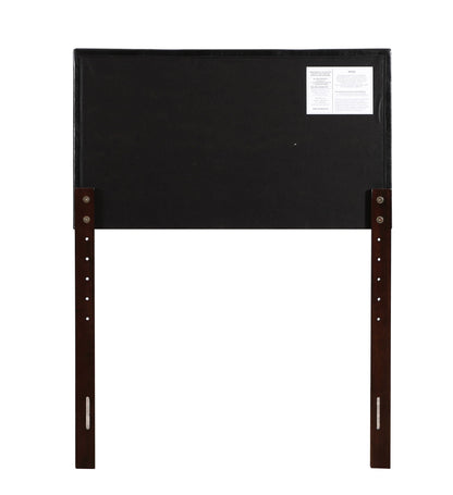 Upholstered black headboard with adjustable height and visible wooden legs on Tampa Home & Garden Store