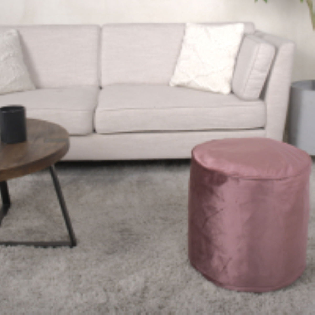 Pink cylinder pouf ottoman with bead-fill interior for accent seating on Tampa Home & Garden Store