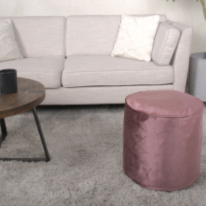 Pink cylinder pouf ottoman with bead-fill interior for accent seating on Tampa Home & Garden Store