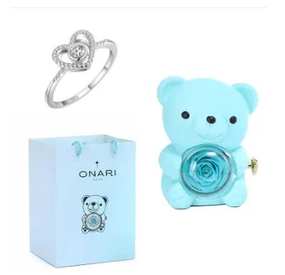 Blue teddy bear jewelry box with blue rose, silver heart ring, and ONARI gift bag on Tampa Home & Garden Store