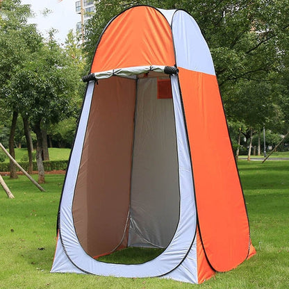 Portable privacy camping shower tent with orange and light-gray panels, open doorway on green lawn on Tampa Home & Garden Store