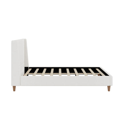 Upholstered platform bed with white wingback headboard, white frame and wooden legs on Tampa Home & Garden Store