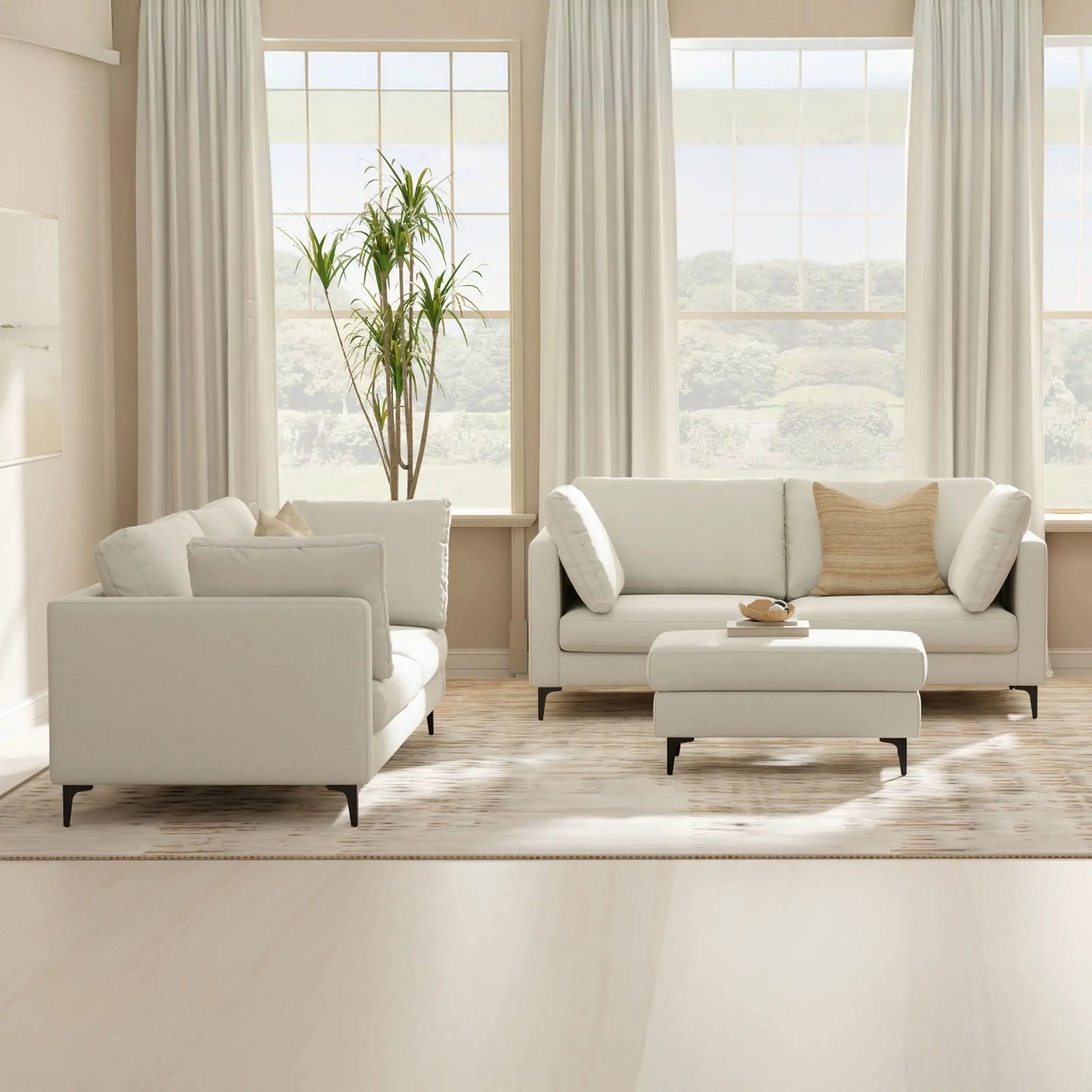 Ava Mid Century Upholstered sofa pair in cream fabric with slim black legs, living room setup on Tampa Home & Garden Store