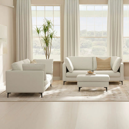 Ava Mid Century Upholstered sofa pair in cream fabric with slim black legs, living room setup on Tampa Home & Garden Store