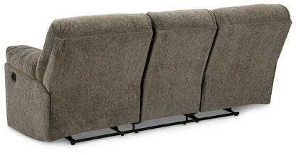 Alphons three-seat power reclining sofa in taupe textured fabric with a metal track base on Tampa Home & Garden Store