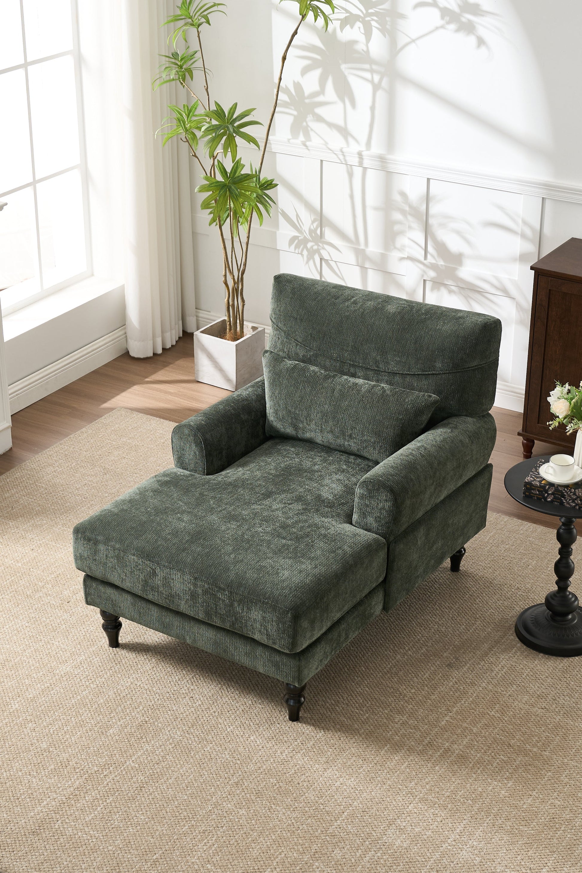 Chaise lounge recliner chair in green upholstery by HouseOfZazla in a sunlit living room on Tampa Home & Garden Store